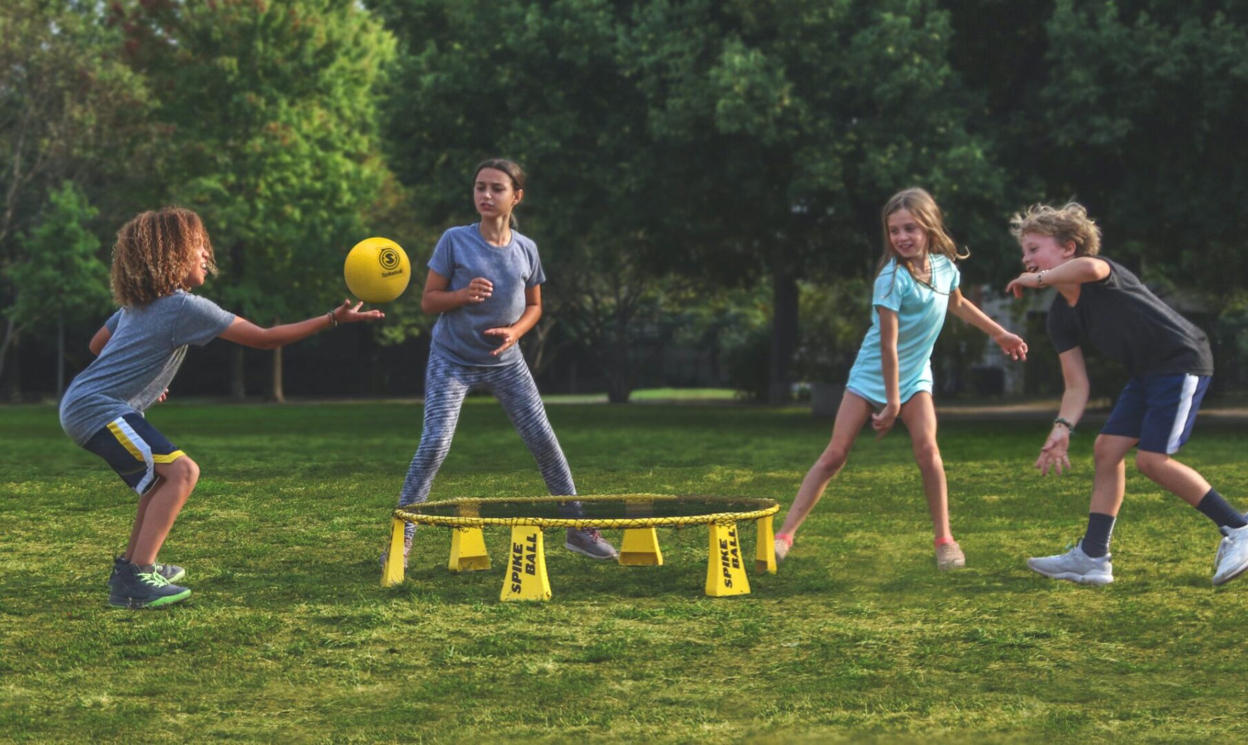 A group of people playing with a frisbee.